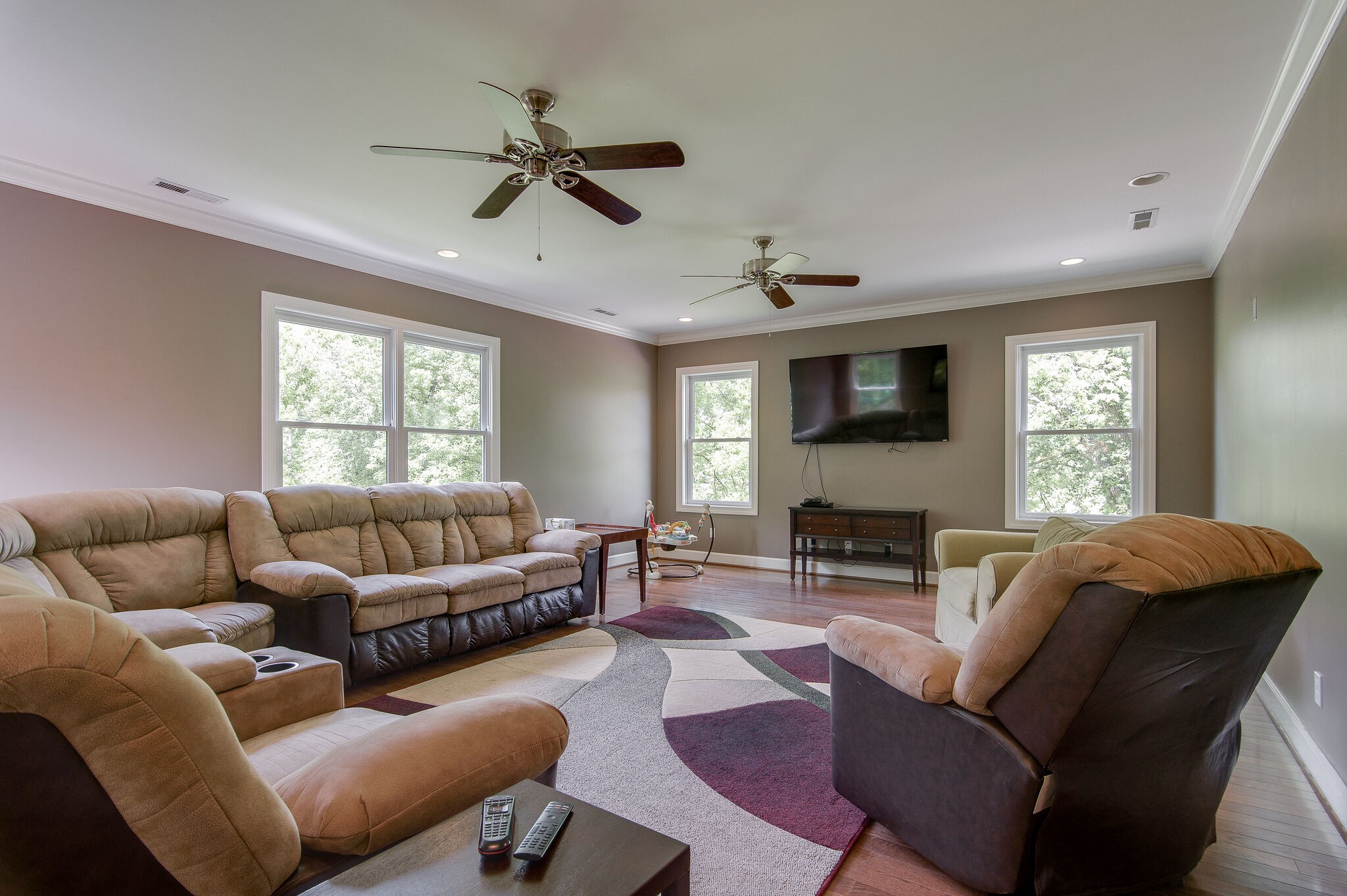 5125 Old Harding Road Franklin, TN 37064 - Photo 24 of 50 a living room with furniture a ceiling fan a fireplace and a window