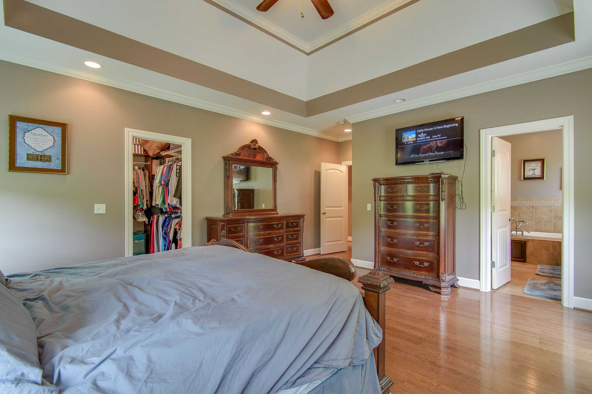 5125 Old Harding Road Franklin, TN 37064 - Photo 29 of 50 a bedroom with a large bed and a flat tv screen