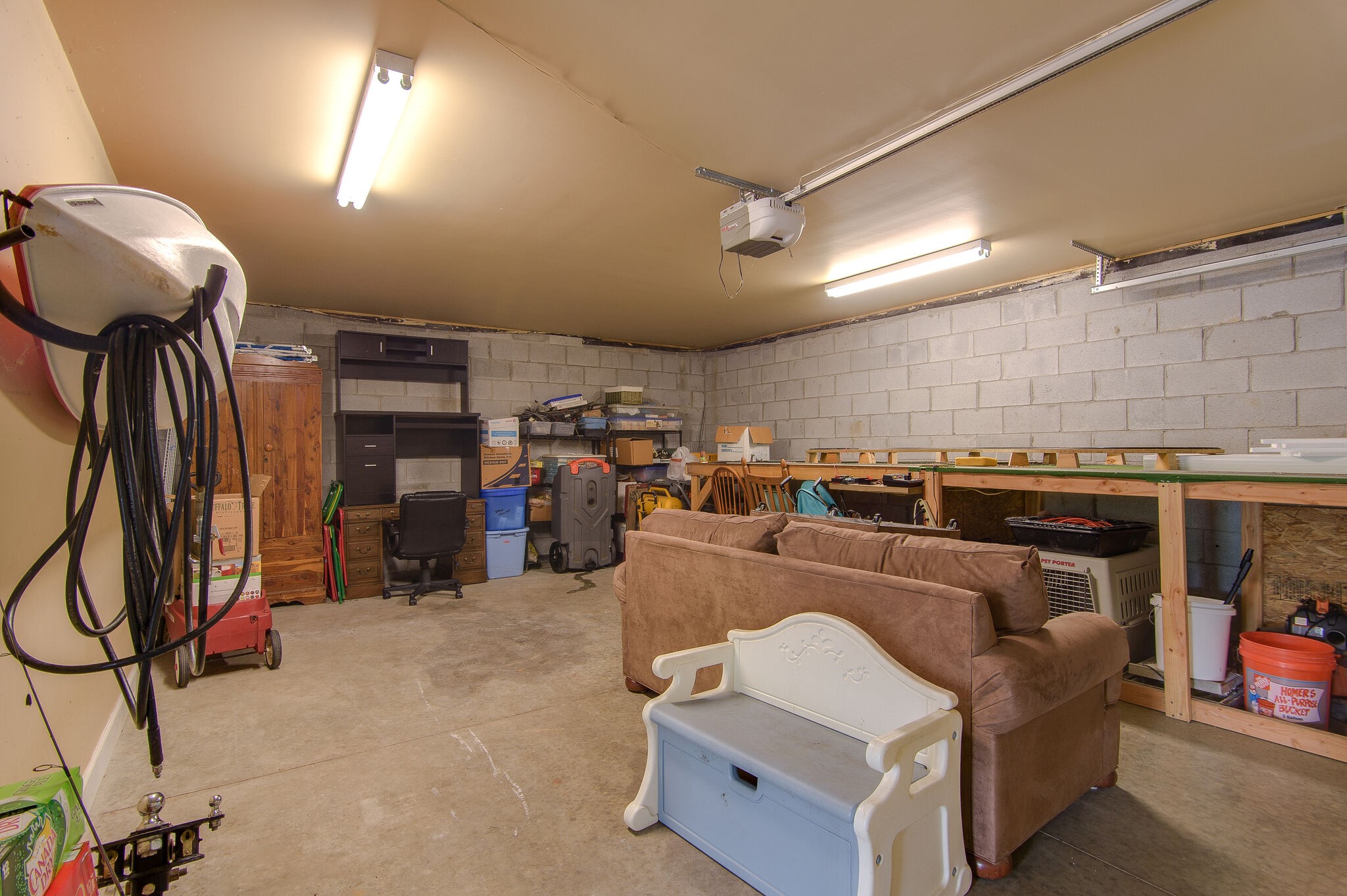 5125 Old Harding Road Franklin, TN 37064 - Photo 32 of 50 a living room with furniture a ceiling fan and a projector