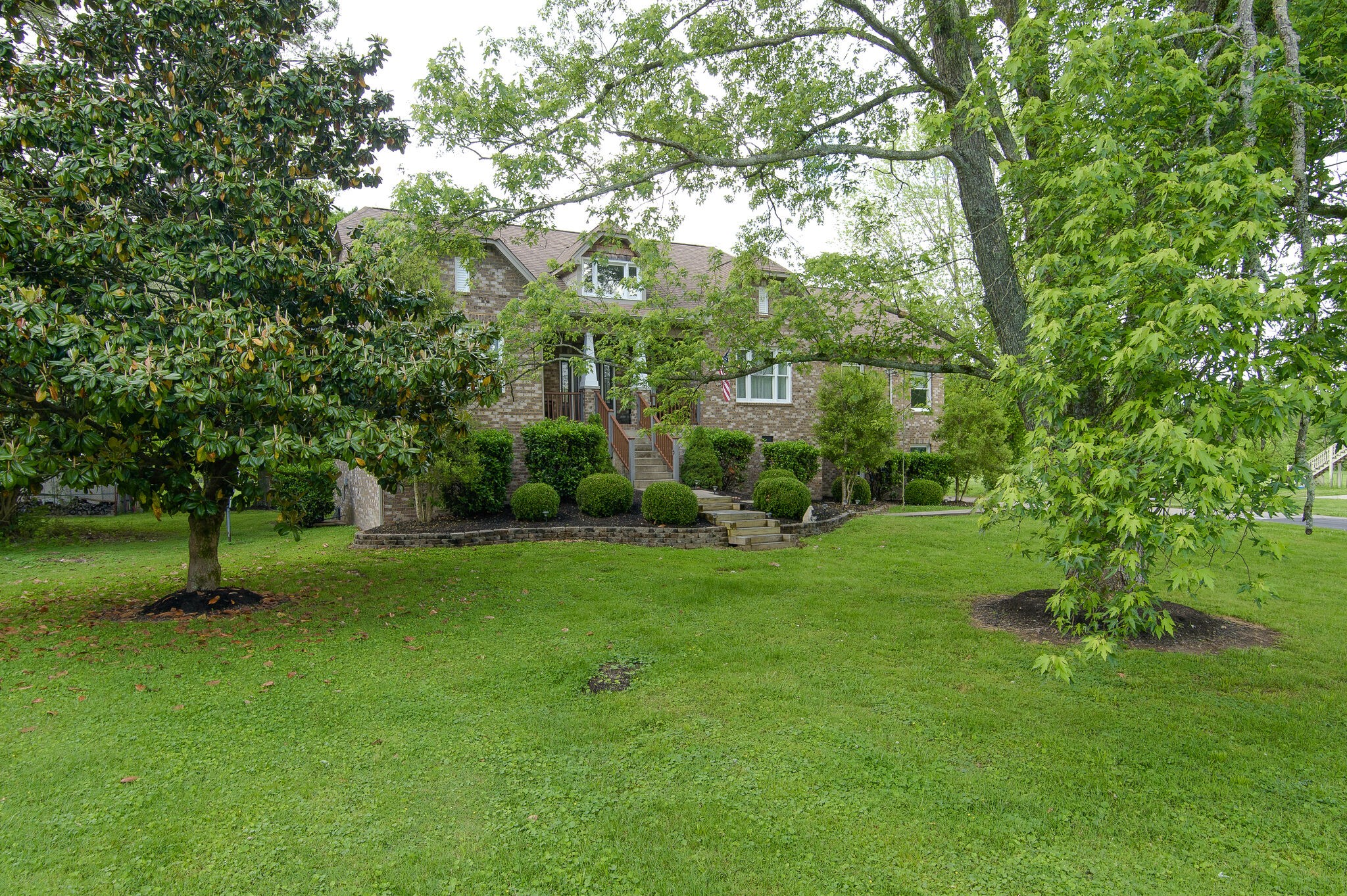 5125 Old Harding Road Franklin, TN 37064 - Photo 4 of 50 a view of a garden with a tree