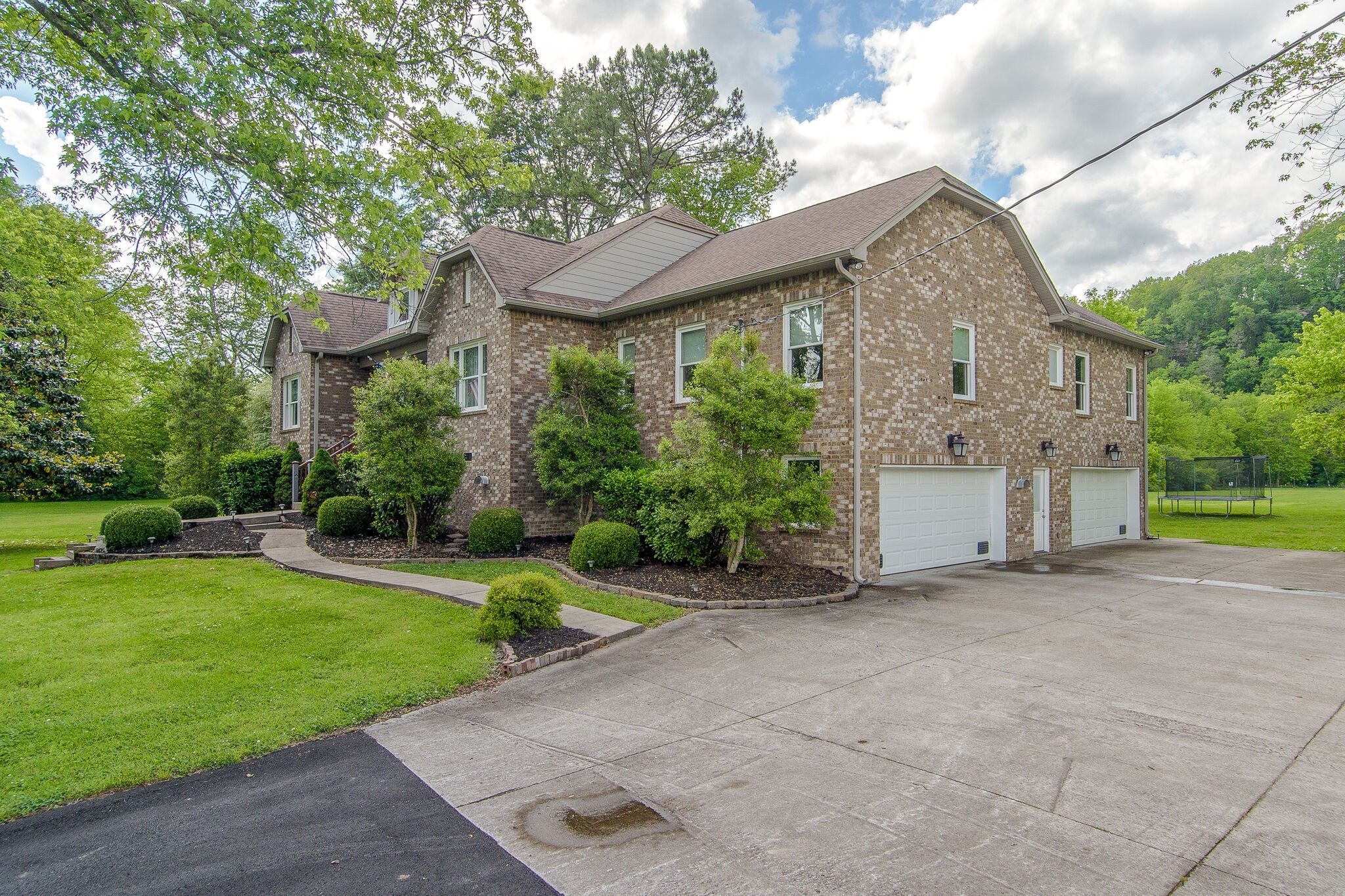 5125 Old Harding Road Franklin, TN 37064 - Photo 6 of 50 a view of a house with a big yard plants and large tree