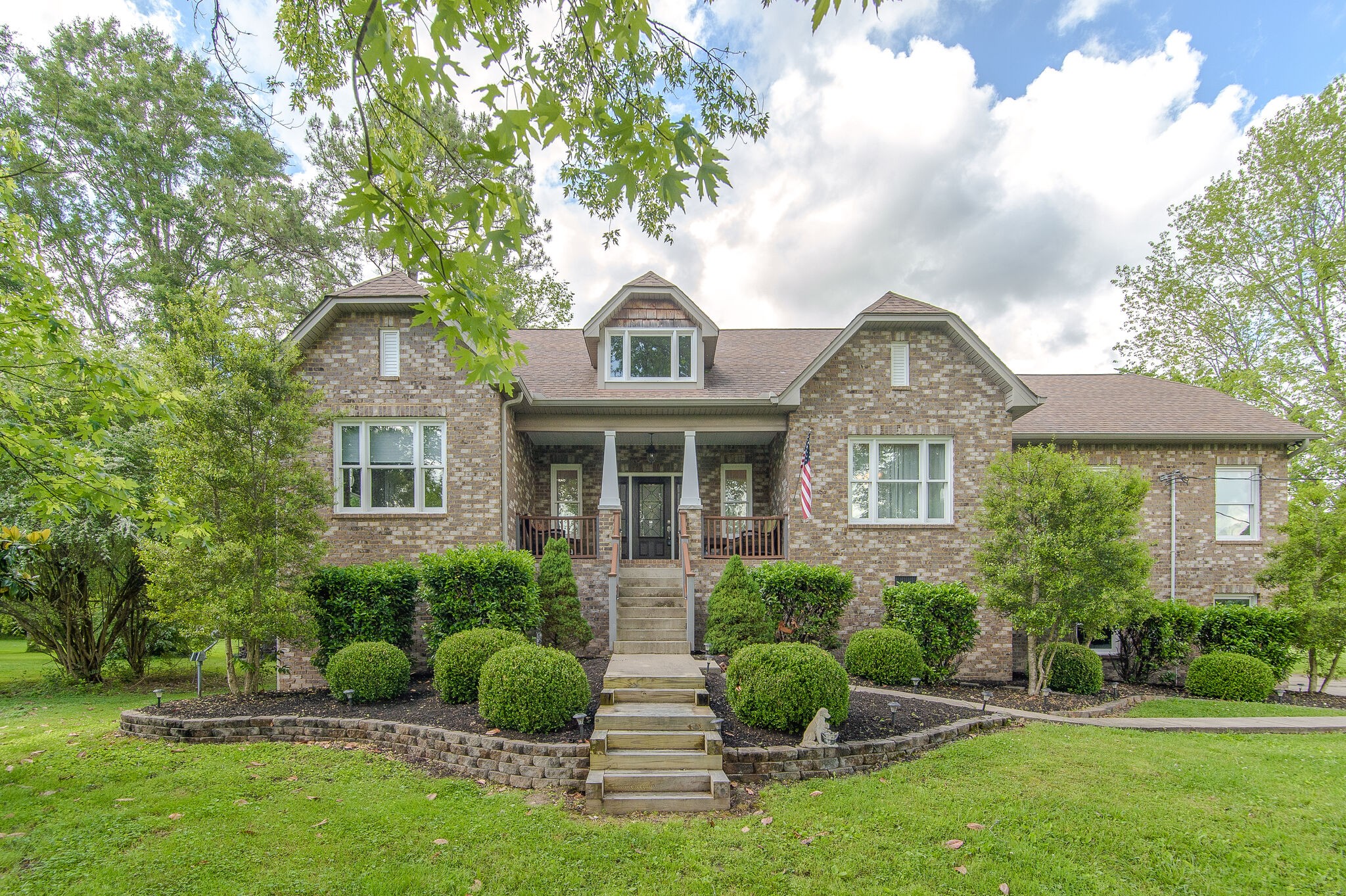 5125 Old Harding Road Franklin, TN 37064 - Photo 7 of 50 a front view of a house with a yard