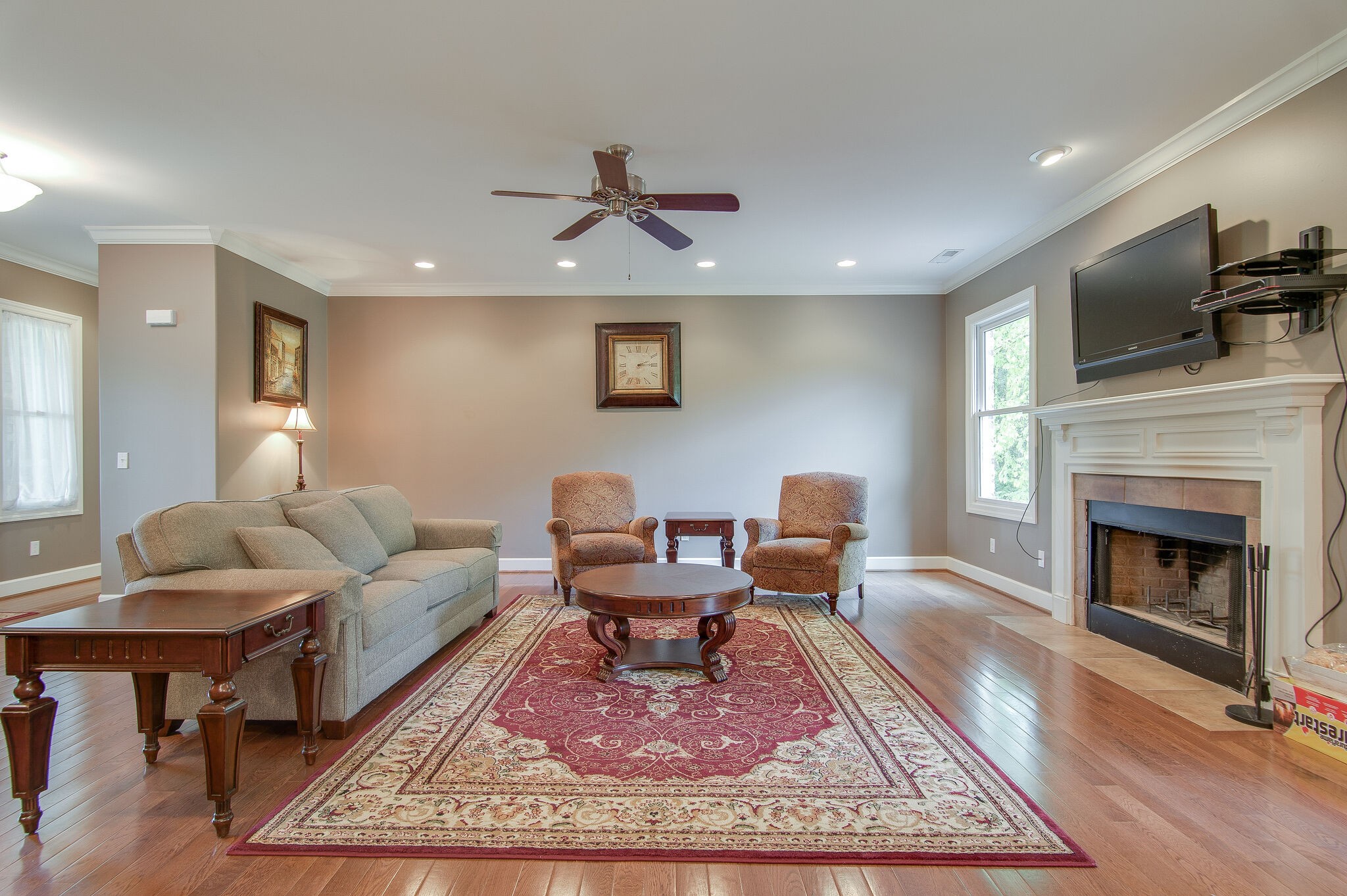 5125 Old Harding Road Franklin, TN 37064 - Photo 10 of 50 a living room with furniture a rug and a fireplace