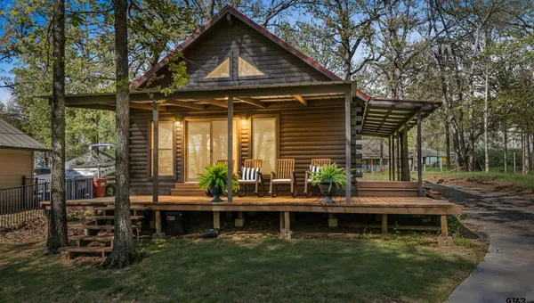 a front view of house with a garden