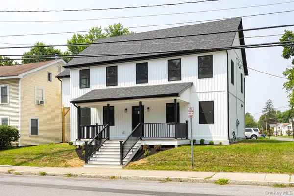 a front view of a house with a porch