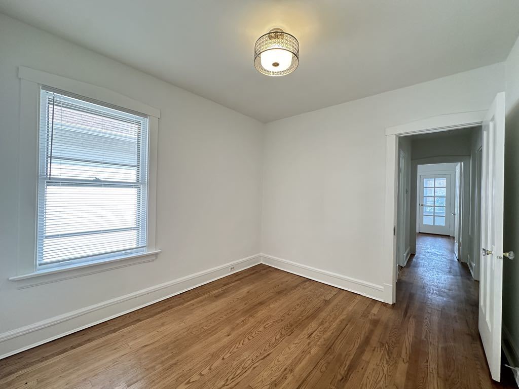 5701 North Keystone Avenue, Unit 1 Chicago, IL 60646 - Photo 13 of 20 a view of a room that has wooden floor and window