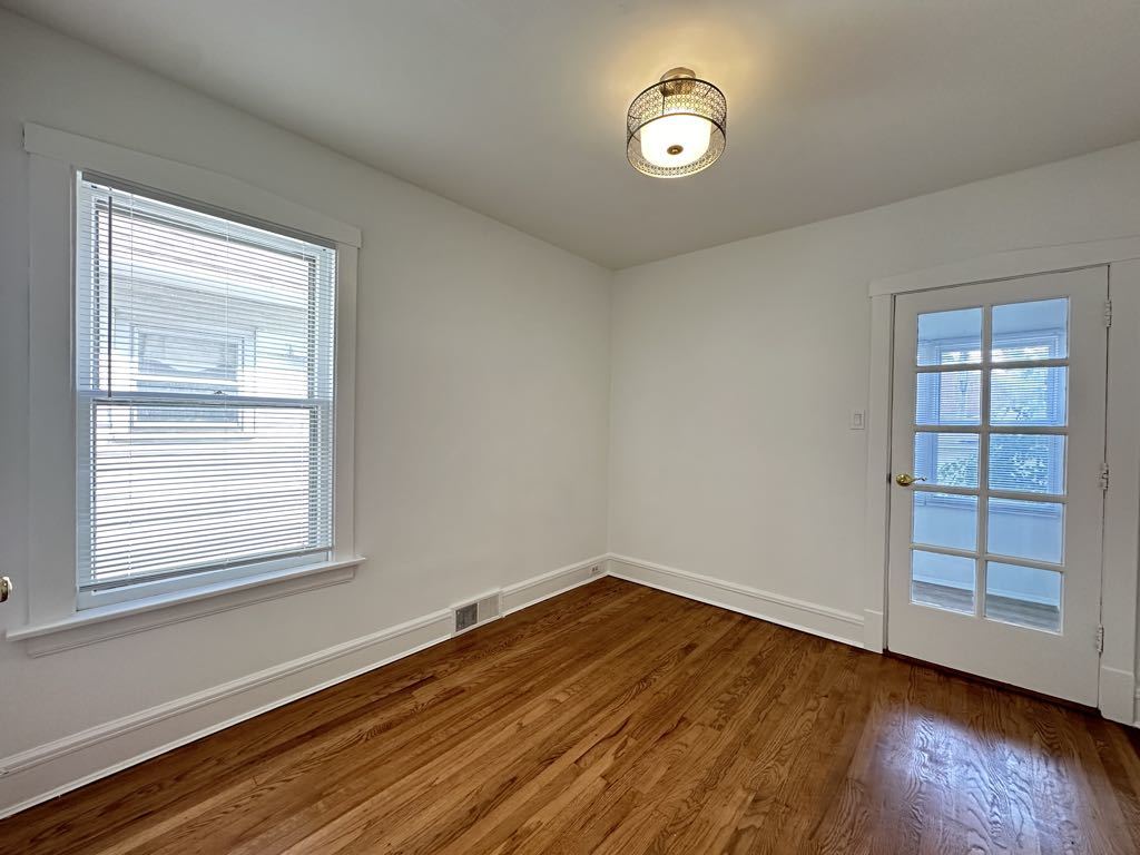 5701 North Keystone Avenue, Unit 1 Chicago, IL 60646 - Photo 15 of 20 a view of a room with wooden floor and windows