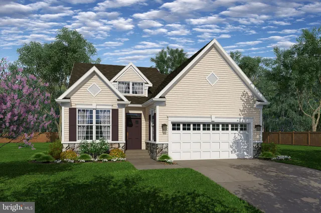 a view of house with yard and green space