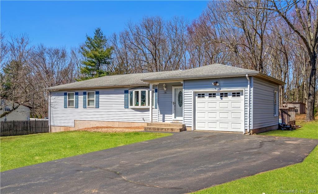716 Griffin Road South Windsor, CT 06074 - Photo 1 of 1 a front view of a house with a garden and yard