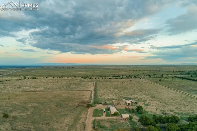 a view of a lake with houses in the back