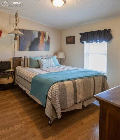 a white toilet sitting next to a sink and a window