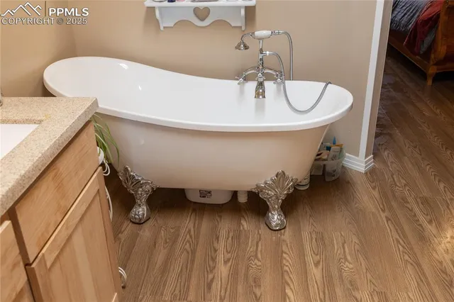 a white bath tub sitting in a bathroom