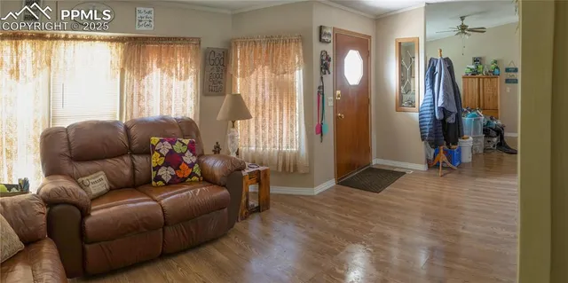 a living room with furniture and a window