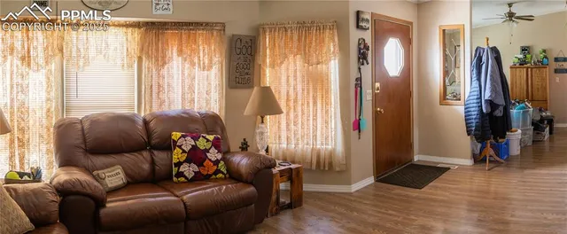 a living room with furniture and a large window