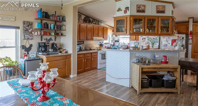 a living room with furniture window and wooden floor