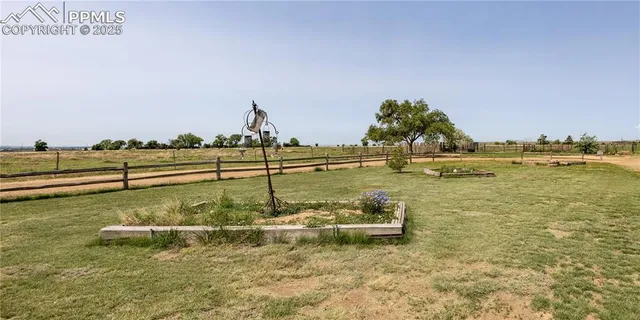 a view of a lake with a yard