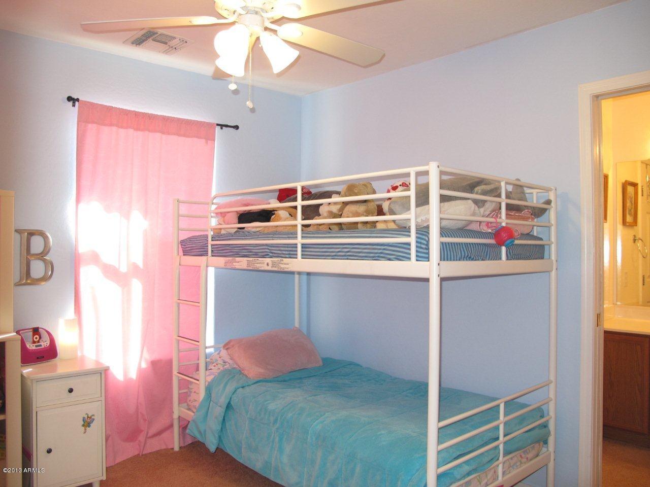 1890 South Rome Street Gilbert, AZ 85295 - Photo 11 of 18 a bedroom with a bed and a window