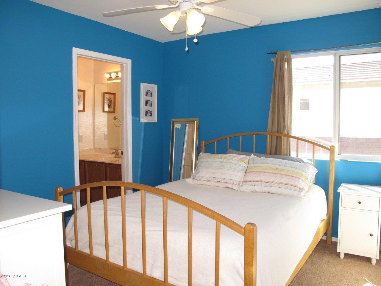 1890 South Rome Street Gilbert, AZ 85295 - Photo 12 of 18 a bedroom with a bed and a window