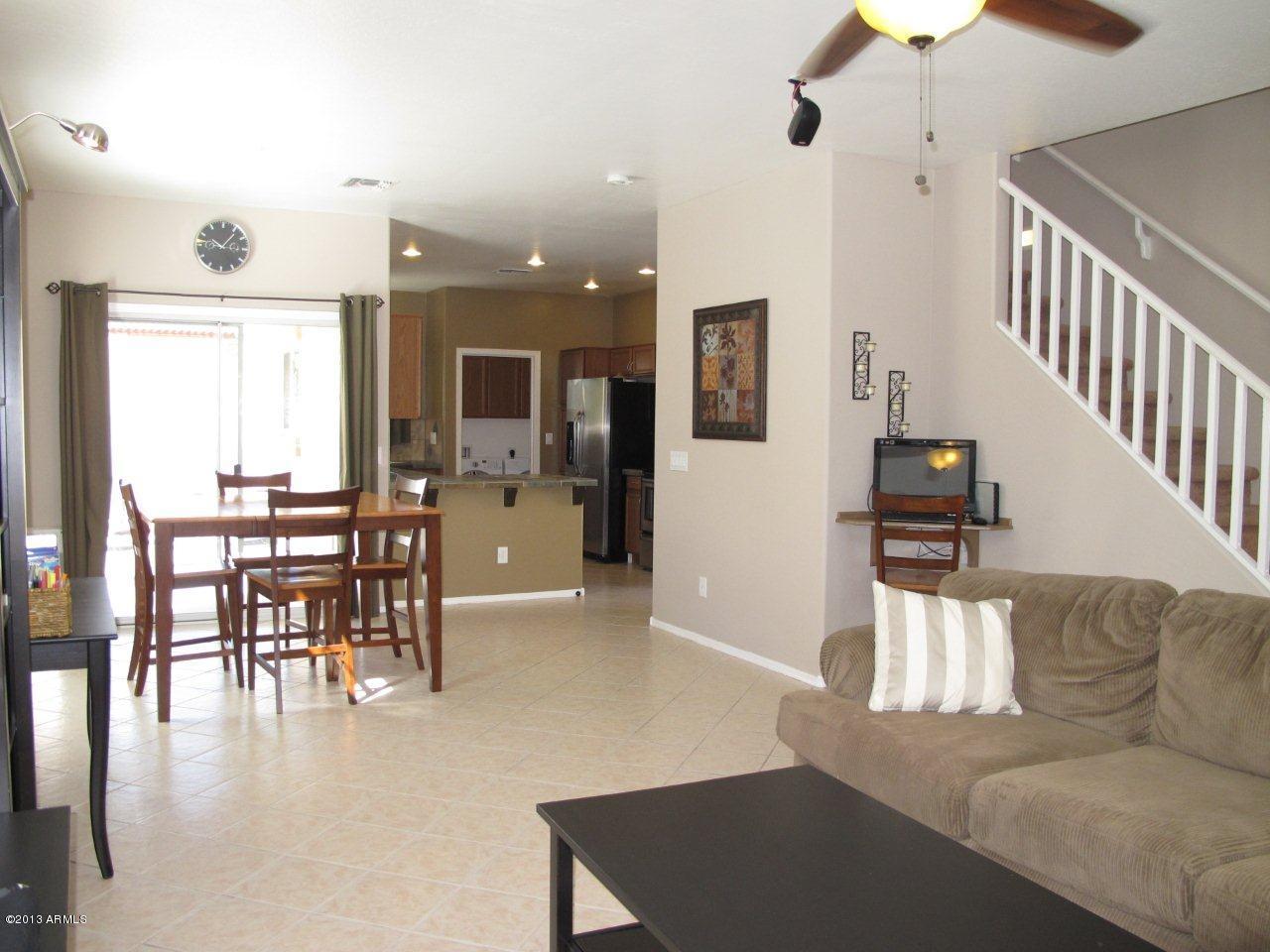 1890 South Rome Street Gilbert, AZ 85295 - Photo 4 of 18 a living room with furniture and wooden floor