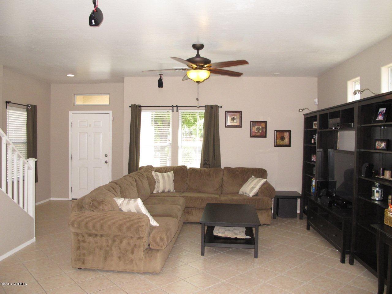 1890 South Rome Street Gilbert, AZ 85295 - Photo 5 of 18 a living room with furniture and a window