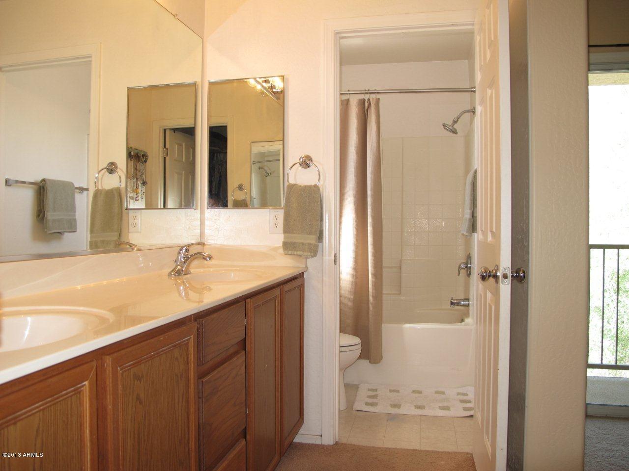 1890 South Rome Street Gilbert, AZ 85295 - Photo 10 of 18 a bathroom with a granite countertop sink and a mirror
