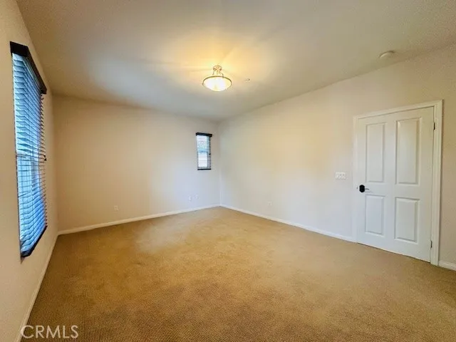 an empty room with a empty space and a window