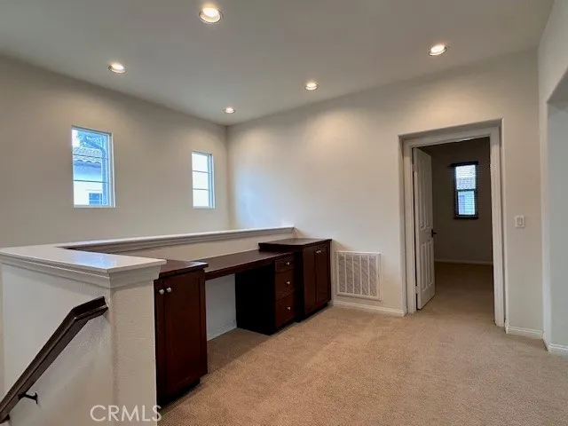 a kitchen with granite countertop a sink and cabinets
