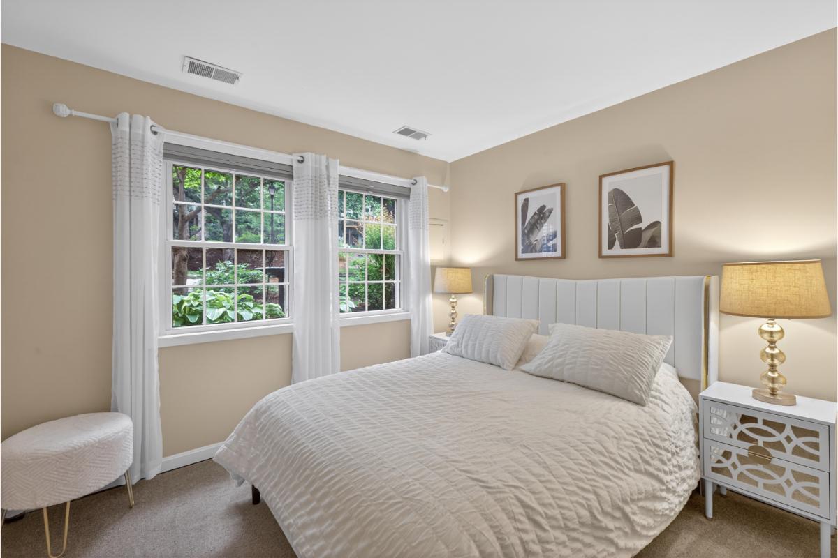 7347 Swan Point Way, Unit 122 Columbia, MD 21045 - Photo 31 of 54 a bedroom with a bed and a chair
