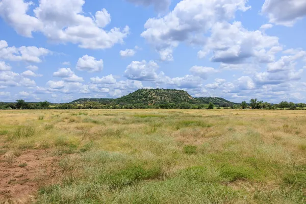 a view of a lake and mountain in the back