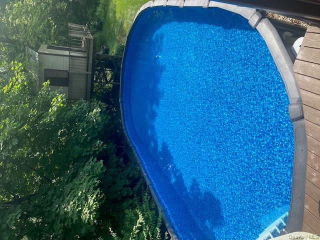 52 Woodland Road Highland Mills, NY 10930 - Photo 19 of 47 Swimming pool with a wooden deck