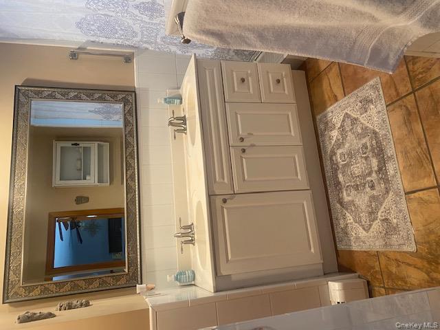 52 Woodland Road Highland Mills, NY 10930 - Photo 26 of 47 Full bath with double vanity, tile walls, and a wainscoted wall