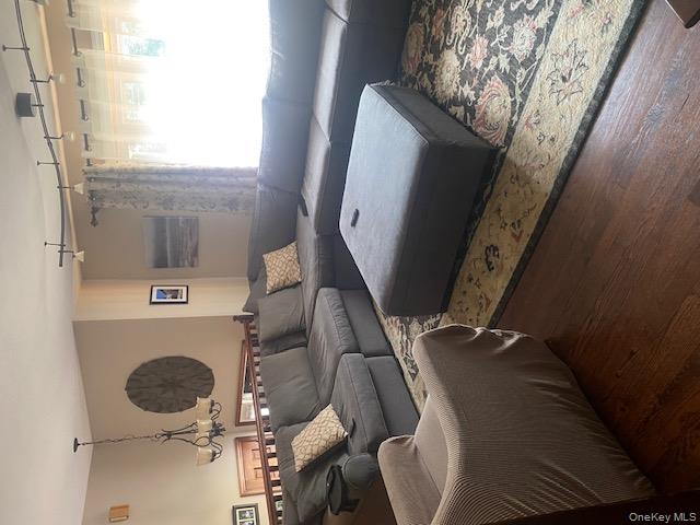 52 Woodland Road Highland Mills, NY 10930 - Photo 4 of 47 Living room featuring a chandelier and wood finished floors