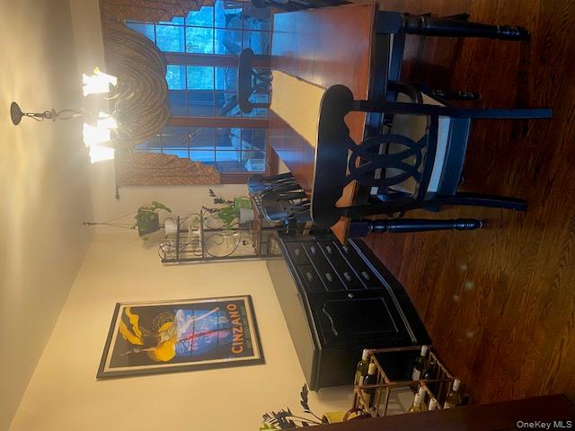 52 Woodland Road Highland Mills, NY 10930 - Photo 10 of 47 Dining space featuring dark wood-style floors and a chandelier