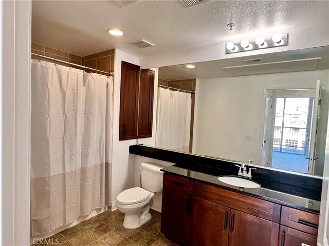 a view of a porch with wooden floor