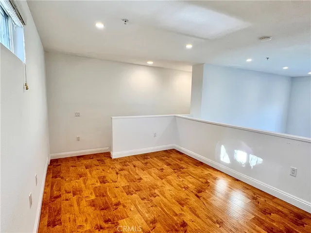 a view of a building with a swimming pool and sitting area