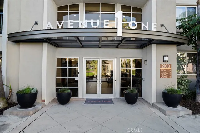 a couple of cars parked in front of brick building