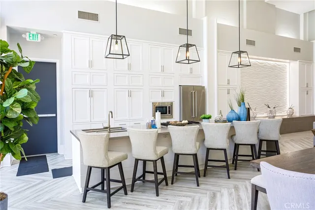 a front view of a building with a garden