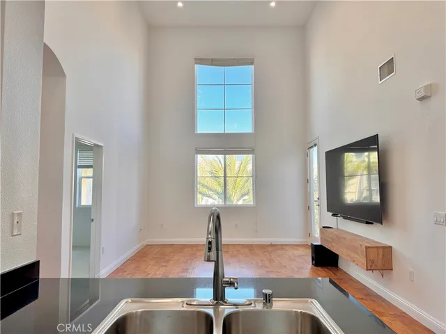 an empty room with windows and closet