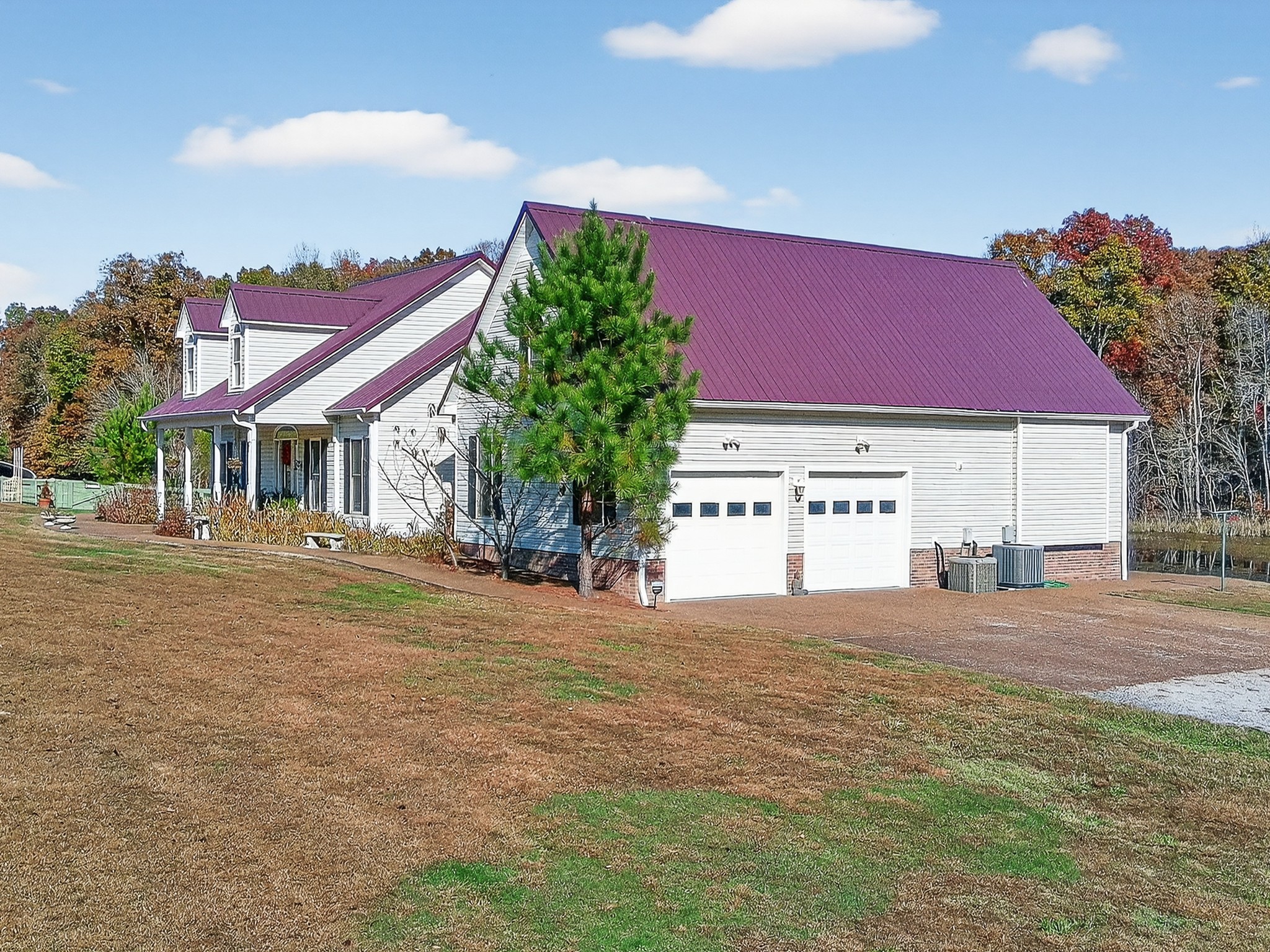 129 Leland Road Summertown, TN 38483 - Photo 12 of 81 a view of a house with a yard and a garage