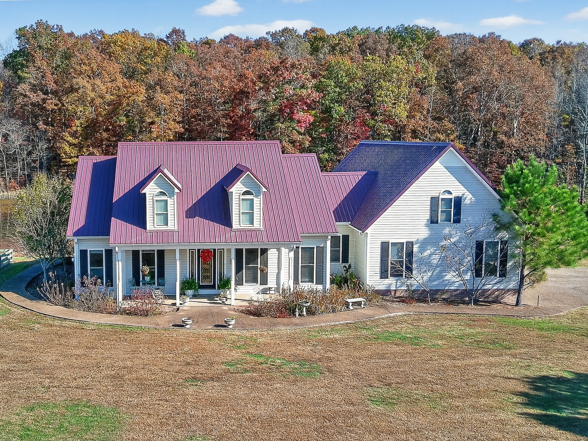 129 Leland Road Summertown, TN 38483 - Photo 2 of 81 a front view of a house with a yard table and chairs