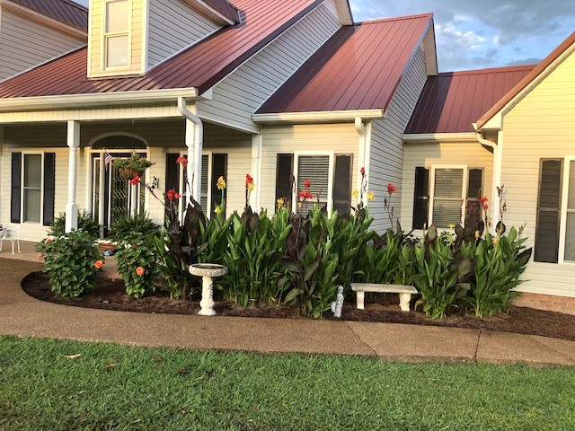 129 Leland Road Summertown, TN 38483 - Photo 21 of 81 a front view of a house with garden