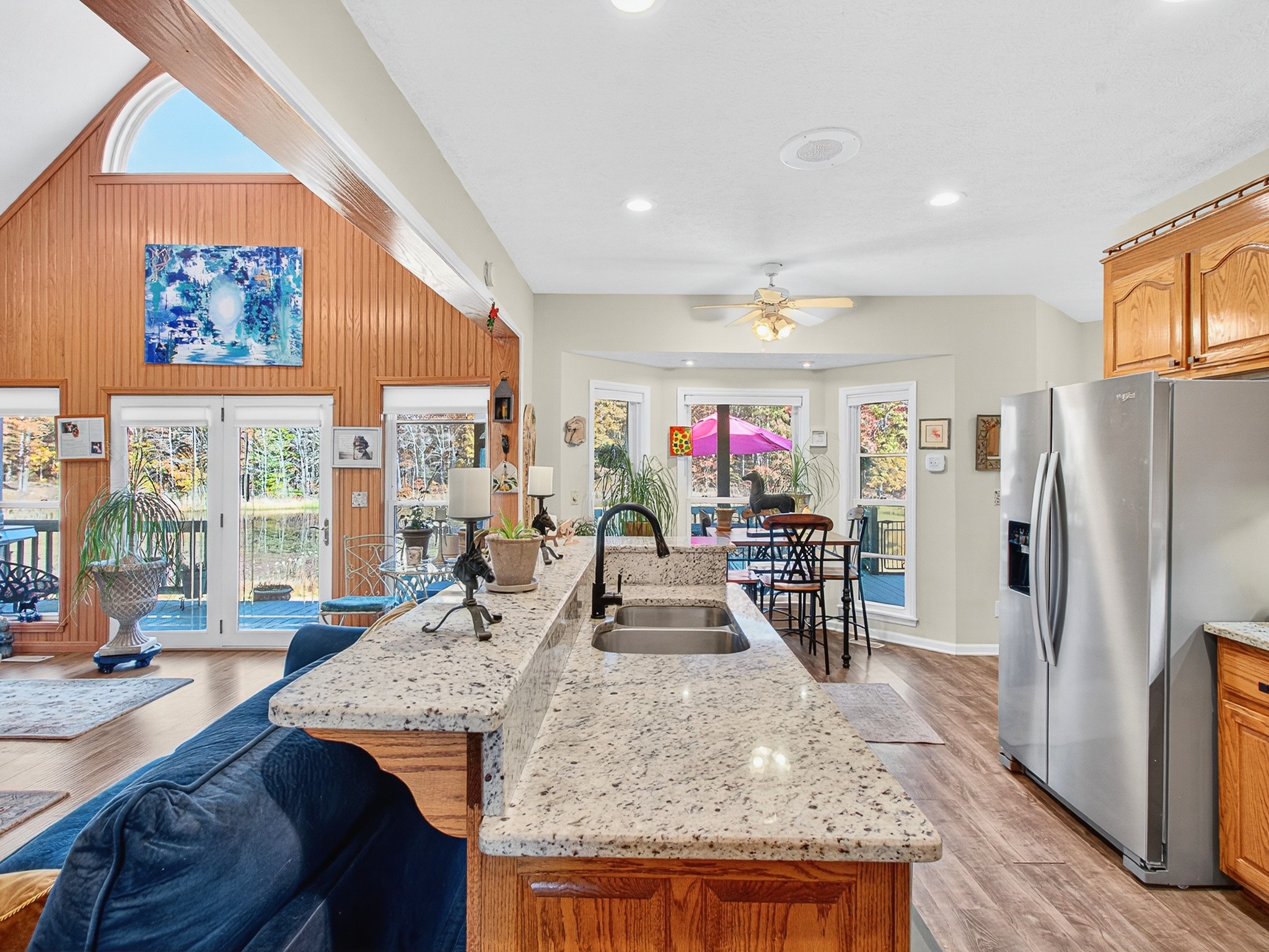 129 Leland Road Summertown, TN 38483 - Photo 39 of 81 a kitchen with stainless steel appliances granite countertop a refrigerator a stove and a sink with wooden floor