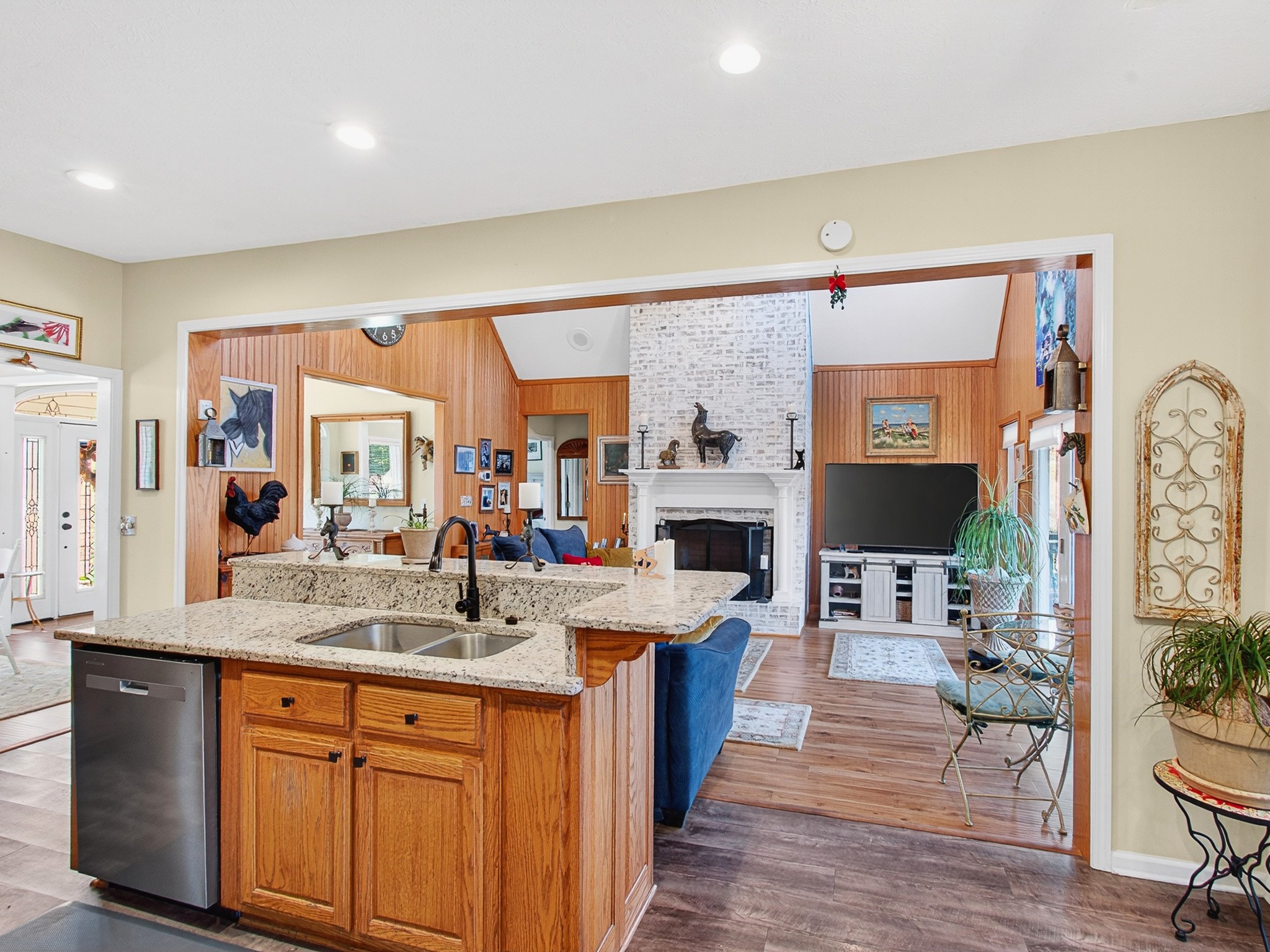 129 Leland Road Summertown, TN 38483 - Photo 44 of 81 a kitchen with stainless steel appliances kitchen island granite countertop a sink stove and wooden floor