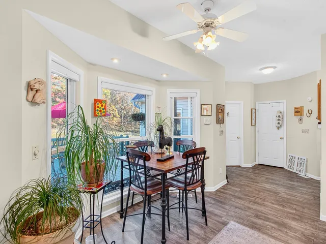 a view of a balcony with furniture and wooden floor