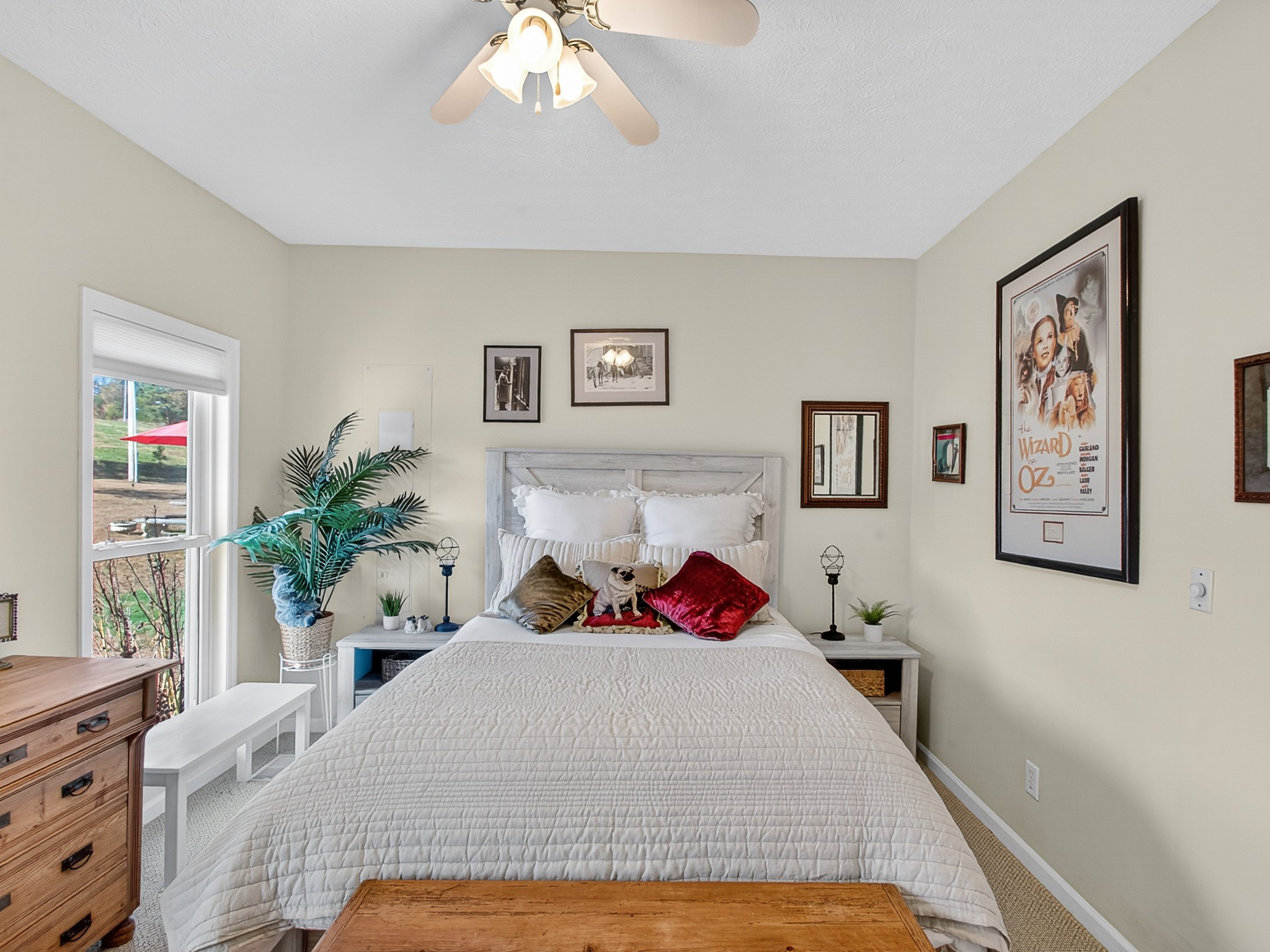 129 Leland Road Summertown, TN 38483 - Photo 48 of 81 a bedroom with a large bed and a chandelier