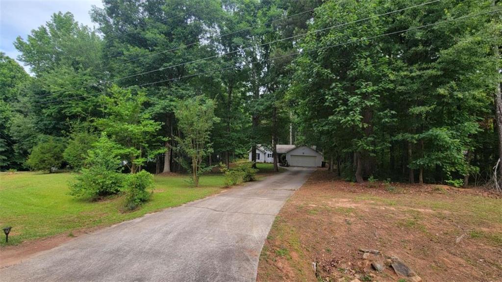 2140 Summerset Drive Monroe, GA 30656 - Photo 2 of 43 a view of backyard with outdoor seating and green space