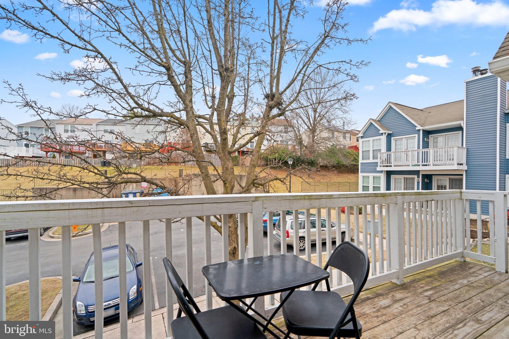 6410 Greenfield Road, Unit 1008 Elkridge, MD 21075 - Photo 12 of 13 a view of balcony with furniture and wooden deck