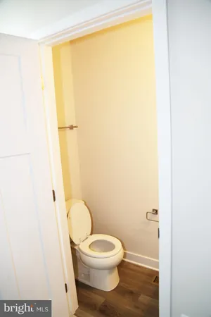 a white toilet sitting next to a sink