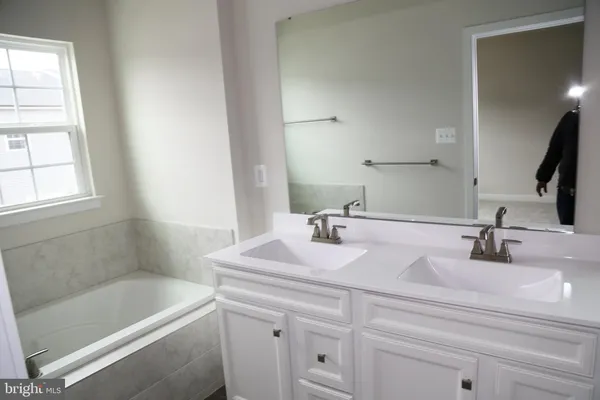 a bathroom with a sink and a bathtub