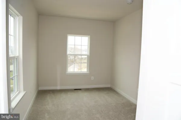 a view of a room that has a window in it